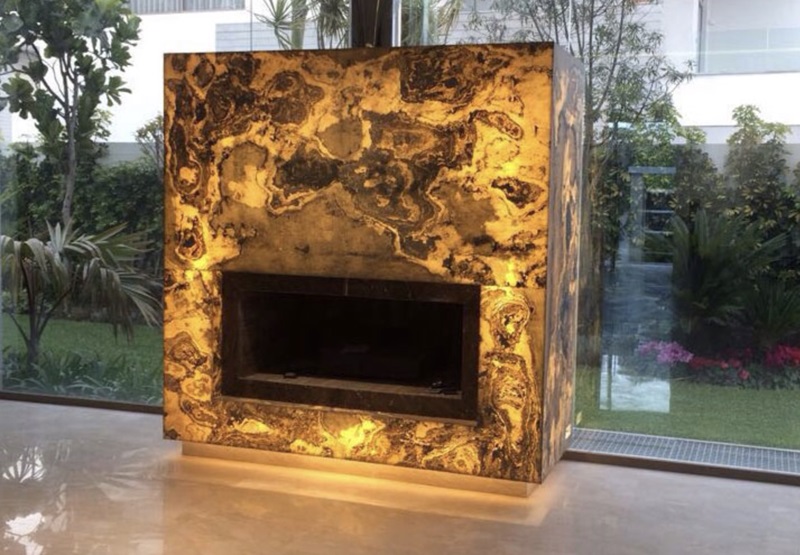 LED light sheet illuminated stone fireplace for residential interior lighting